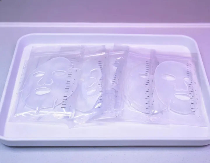 Hydrogel face mask pouches on a lab tray, illustration only